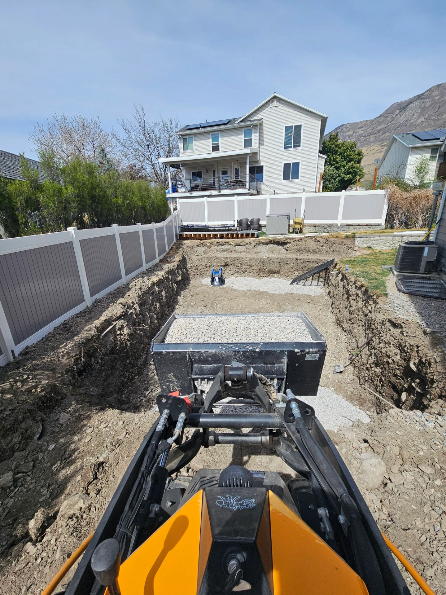 Precision excavation and gravel base prep for a new fiberglass pool