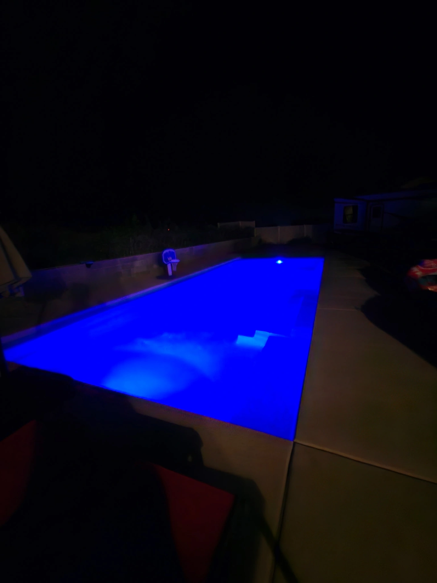 Pool glowing deep blue with color-changing LED lights